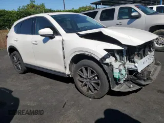 2017 Mazda CX-5 Grand Touring with VIN JM3KFBDL7H0202831, listed as a Copart auction lot 54943115 with 69,933 mi miles and Salvage Title. Bid and sale history available at carsss.com. Image 4.
