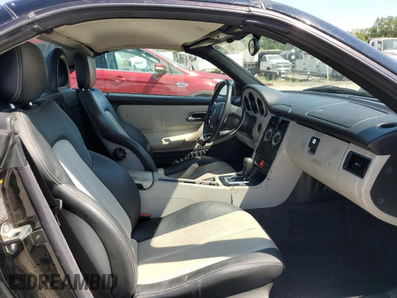 1999 Mercedes-Benz SLK-Class with VIN WDBKK47F5XF129037, listed as a Copart auction lot 68842504 with 74,397 mi miles and Salvage Title. Bid and sale history available at carsss.com. Image 11.