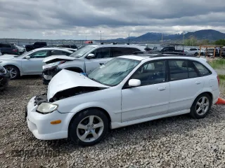2002 Mazda Protege z VIN JM1BJ245721470434, wystawiony jako Copart lot #57293765 z przebiegiem 144 622 mil mil oraz Szkoda całkowita • Salvage title. Historia ofert i sprzedaży dostępna na DreamBid. Obrazek 1.