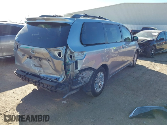 2014 Toyota Sienna XLE with VIN 5TDYK3DC7ES447903, listed as a IAAI auction lot 41835665 with 224,492 mi miles. Bid and sale history available at carsss.com. Image 4.