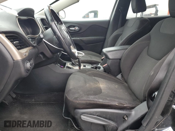 2015 Jeep Cherokee Latitude with VIN 1C4PJLCB9FW706934, listed as a Copart auction lot 52696105 with 125,205 mi miles and Salvage Title. Bid and sale history available at DreamBid. Image 7.