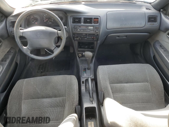 1994 Toyota Corolla Deluxe with VIN JT2AE09B4R0067104, listed as a Copart auction lot 83565064 with 207,923 mi miles and Salvage title. Bid and sale history available at DreamBid. Image 8.