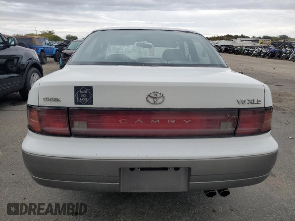 1994 Toyota Camry XLE with VIN JT2GK13E5R0008509, listed as a Copart auction lot 76014164 with 188,427 mi miles and Salvage Title. Bid and sale history available at carsss.com. Image 6.