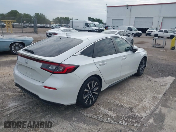2023 Honda Civic EX-L with VIN 19XFL1H70PE014510, listed as a IAAI auction lot 42395890 with 14,163 mi miles and . Bid and sale history available at DreamBid. Image 4.