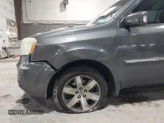 2012 Honda Pilot Touring with VIN 5FNYF4H99CB052034, listed as a IAAI auction lot 42023430 with 137,428 mi miles. Bid and sale history available at carsss.com. Image 6.
