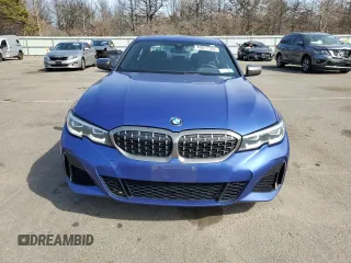 2020 BMW 3 Series M340i xDrive with VIN WBA5U9C00LFH68766, listed as a Copart auction lot 49077125 with 56,730 mi miles and Salvage Title. Bid and sale history available at DreamBid. Image 5.