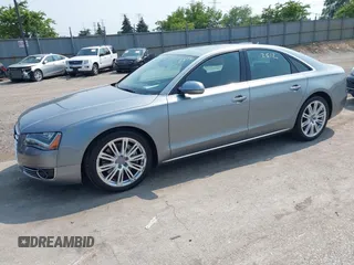 2013 Audi A8 4.0L with VIN WAUA2AFD5DN021950, listed as a IAAI auction lot 42472512 with 126,964 mi miles and . Bid and sale history available at DreamBid. Image 2.