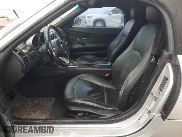 2007 BMW Z4 3.0i with VIN 4USBU33567LW73304, listed as a Copart auction lot 52391705 with 192,945 mi miles and Salvage title. Bid and sale history available at DreamBid. Image 7.