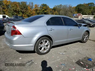 2012 Ford Fusion SE with VIN 3FAHP0HA9CR267305, listed as a Copart auction lot 77114304 with 165,781 mi miles and Salvage Title. Bid and sale history available at carsss.com. Image 3.