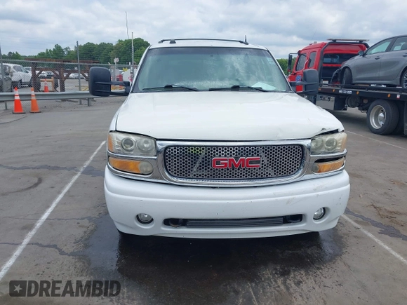 2005 GMC Yukon Denali z VIN 1GKEK63U55J259803, wystawiony jako IAAI lot #42126835 z przebiegiem 199 762 mil mil oraz . Historia ofert i sprzedaży dostępna na DreamBid. Obrazek 12.