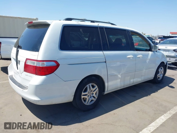 2005 Honda Odyssey EX with VIN 5FNRL38465B081716, listed as a IAAI auction lot 41998956 with 173,182 mi miles and . Bid and sale history available at carsss.com. Image 4.
