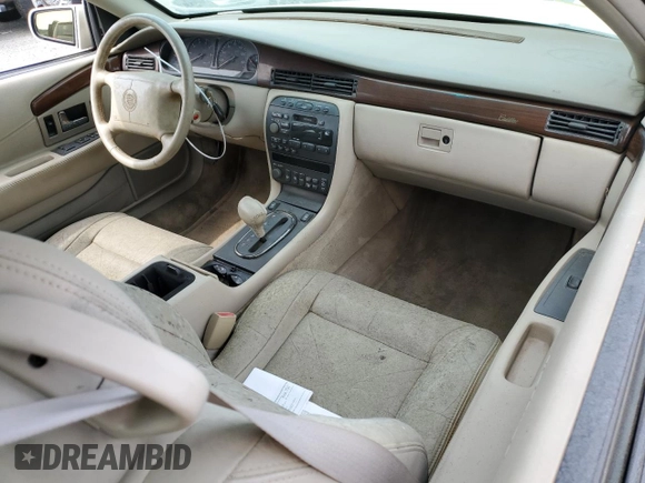 1999 Cadillac Eldorado z VIN 1G6EL12Y7XU615169, wystawiony jako Copart lot #76459744 z przebiegiem Nie podano mil oraz Szkoda całkowita • Salvage title. Historia ofert i sprzedaży dostępna na DreamBid. Obrazek 8.