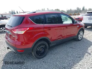 2015 Ford Escape Titanium with VIN 1FMCU9J93FUB28037, listed as a IAAI auction lot 42432345 with 133,242 mi miles and . Bid and sale history available at DreamBid. Image 4.