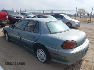1996 Pontiac Grand Am SE with VIN 1G2NE52M8TC810732, listed as a IAAI auction lot 42338979 with 107,027 mi miles and . Bid and sale history available at DreamBid. Image 3.