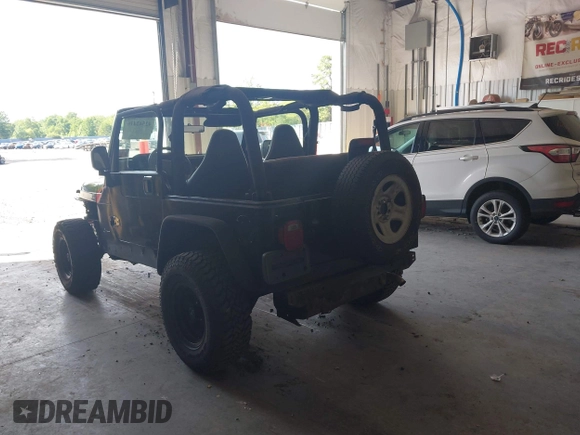 1999 Jeep Wrangler Sport with VIN 1J4FY19S4XP494405, listed as a IAAI auction lot 42542416 with 168,856 mi miles and . Bid and sale history available at DreamBid. Image 3.