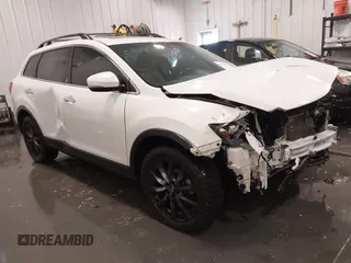 2015 Mazda CX-9 Grand Touring z VIN JM3TB3DAXF0456941, wystawiony jako IAAI lot #41674059 z przebiegiem 129 747 mil mil oraz . Historia ofert i sprzedaży dostępna na DreamBid. Obrazek 1.