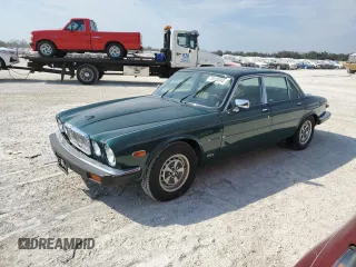 1985 Jaguar XJ z VIN SAJAV134XFC411652, wystawiony jako Copart lot #75114634 z przebiegiem 50 945 mil mil oraz Szkoda całkowita • Salvage title. Historia ofert i sprzedaży dostępna na DreamBid. Obrazek 1.