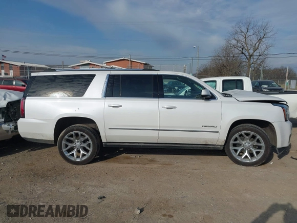 2020 GMC Yukon XL Denali with VIN 1GKS1HKJ6LR282854, listed as a IAAI auction lot 41717072 with 56,715 mi miles and . Bid and sale history available at DreamBid. Image 13.