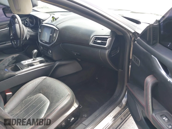 2015 Maserati Ghibli with VIN ZAM57XSA1F1144073, listed as a IAAI auction lot 42770723 with 105,782 mi miles and . Bid and sale history available at DreamBid. Image 5.