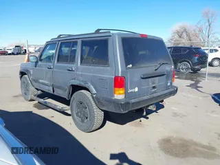 1997 Jeep Cherokee Sport with VIN 1J4FJ68S4VL567490, listed as a IAAI auction lot 41659872 with 404,766 mi miles. Bid and sale history available at carsss.com. Image 3.