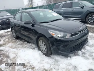 2023 Kia Rio S with VIN 3KPA24AD4PE562234, listed as a IAAI auction lot 41552788 with 56,721 mi miles. Bid and sale history available at carsss.com. Image 1.