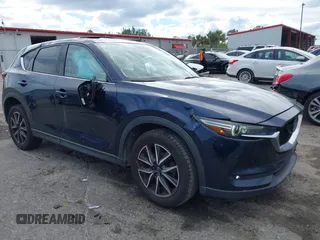 2018 Mazda CX-5 Grand Touring z VIN JM3KFADM7J1438656, wystawiony jako IAAI lot #41684516 z przebiegiem 93 075 mil mil oraz . Historia ofert i sprzedaży dostępna na DreamBid. Obrazek 1.