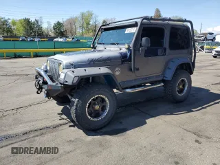 2000 Jeep Wrangler Sport z VIN 1J4FA49S1YP727549, wystawiony jako Copart lot #56125015 z przebiegiem 272 086 mil mil oraz Szkoda całkowita • Salvage title. Historia ofert i sprzedaży dostępna na DreamBid. Obrazek 1.