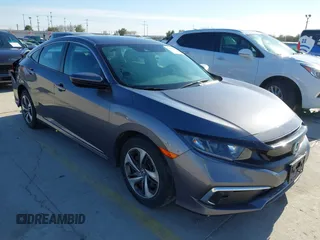 2020 Honda Civic LX z VIN 19XFC2F69LE005590, wystawiony jako IAAI lot #41388921 z przebiegiem 61 185 mil mil oraz . Historia ofert i sprzedaży dostępna na DreamBid. Obrazek 1.