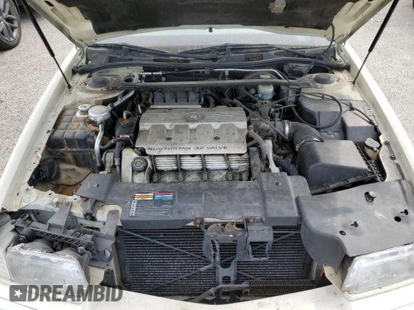 1999 Cadillac Eldorado z VIN 1G6EL12Y7XU615169, wystawiony jako Copart lot #76459744 z przebiegiem Nie podano mil oraz Szkoda całkowita • Salvage title. Historia ofert i sprzedaży dostępna na DreamBid. Obrazek 11.