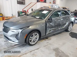 2021 Cadillac CT4 Luxury with VIN 1G6DA5RK4M0147723, listed as a IAAI auction lot 41646082 with 14,459 mi miles and . Bid and sale history available at DreamBid. Image 2.