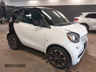 2016 Smart fortwo Passion z VIN WMEFJ5DA9GK061774, wystawiony jako IAAI lot #42005599 z przebiegiem 44 323 mil mil oraz . Historia ofert i sprzedaży dostępna na DreamBid. Obrazek 1.