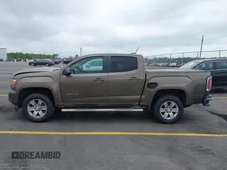 2015 GMC Canyon 2WD SLE with VIN 1GTG5BE38F1229799, listed as a IAAI auction lot 41944801 with 71,165 mi miles. Bid and sale history available at carsss.com. Image 14.