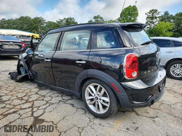 2014 MINI Countryman S with VIN WMWZC3C56EWP25479, listed as a Copart auction lot 61197525 with 101,146 mi miles and Salvage title. Bid and sale history available at DreamBid. Image 2.