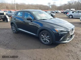 2018 Mazda CX-3 Grand Touring with VIN JM1DKFD70J0313976, listed as a IAAI auction lot 41238631 with 51,901 mi miles. Bid and sale history available at carsss.com. Image 1.