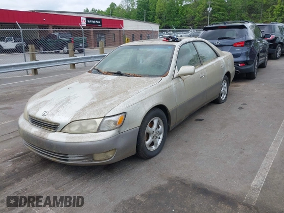 1998 Lexus ES 300 Luxury Sport Sdn with VIN JT8BF28G2W5023651, listed as a IAAI auction lot 42106837 with 245,107 mi miles. Bid and sale history available at carsss.com. Image 2.