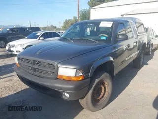 2003 Dodge Dakota SLT with VIN 1D7HG48N33S248568, listed as a IAAI auction lot 41834084 with 153,001 mi miles and . Bid and sale history available at DreamBid. Image 2.