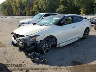 2018 Nissan Maxima SL z VIN 1N4AA6AP3JC387407, wystawiony jako Copart lot #74363774 z przebiegiem 105 745 mil mil oraz Czysty tytuł • Clean title. Historia ofert i sprzedaży dostępna na DreamBid. Obrazek 1.