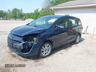 2015 Mazda 5 Sport z VIN JM1CW2BL9F0187973, wystawiony jako IAAI lot #42378711 z przebiegiem 97 543 mil mil oraz . Historia ofert i sprzedaży dostępna na DreamBid. Obrazek 2.