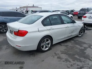 2015 BMW 3 Series 320i with VIN WBA3B1C5XFK137171, listed as a IAAI auction lot 41736278 with 28,673 mi miles. Bid and sale history available at carsss.com. Image 4.