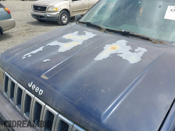 1994 Jeep Grand Cherokee Laredo z VIN 1J4GZ58Y2RC320793, wystawiony jako IAAI lot #42781115 z przebiegiem 275 518 mil mil oraz . Historia ofert i sprzedaży dostępna na DreamBid. Obrazek 6.