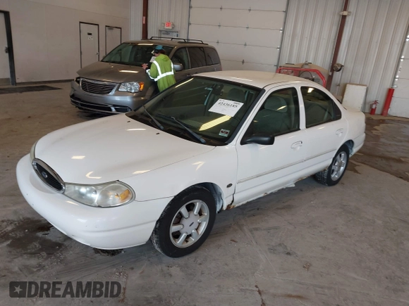 1999 Ford Contour SE z VIN 1FAFP6634XK138025, wystawiony jako IAAI lot #42436185 z przebiegiem 90 226 mil mil oraz . Historia ofert i sprzedaży dostępna na DreamBid. Obrazek 2.