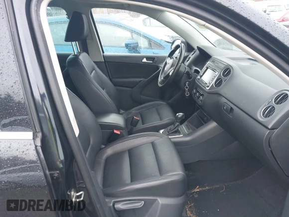 2012 Volkswagen Tiguan SEL with VIN WVGAV7AX2CW529232, listed as a IAAI auction lot 41955121 with 164,885 mi miles and . Bid and sale history available at DreamBid. Image 5.