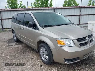 2009 Dodge Grand Caravan SE z VIN 2D8HN44E89R687315, wystawiony jako IAAI lot #42286929 z przebiegiem 215 894 mil mil oraz . Historia ofert i sprzedaży dostępna na DreamBid. Obrazek 1.