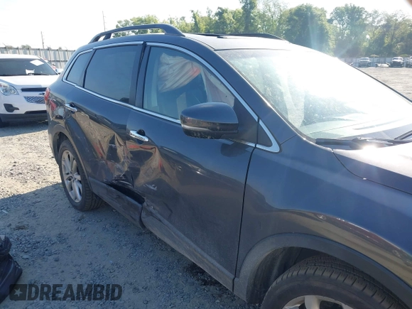 2013 Mazda CX-9 Grand Touring z VIN JM3TB2DA6D0424124, wystawiony jako IAAI lot #42032588 z przebiegiem 151 569 mil mil oraz . Historia ofert i sprzedaży dostępna na DreamBid. Obrazek 6.