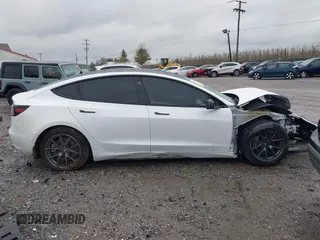 2022 Tesla Model 3 Long Range with VIN 5YJ3E1EB0NF129945, listed as a IAAI auction lot 41965531 with 59,162 mi miles and . Bid and sale history available at DreamBid. Image 13.