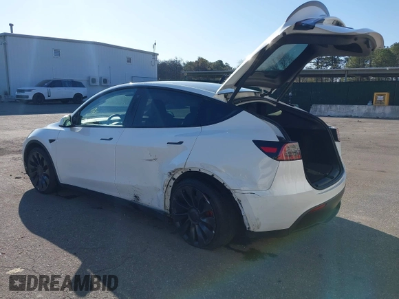 2023 Tesla Model Y Performance with VIN 7SAYGDEF3PF711497, listed as a IAAI auction lot 41877450 with 21,887 mi miles and . Bid and sale history available at DreamBid. Image 3.