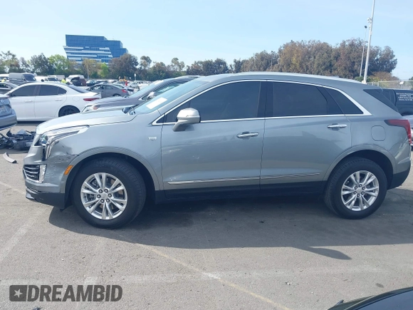 2023 Cadillac XT5 FWD Luxury z VIN 1GYKNAR49PZ137556, wystawiony jako IAAI lot #41934199 z przebiegiem 13 298 mil mil oraz . Historia ofert i sprzedaży dostępna na DreamBid. Obrazek 14.