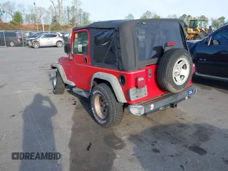 2003 Jeep Wrangler Sport with VIN 1J4FA49S13P320159, listed as a IAAI auction lot 41935699 with 212,355 mi miles. Bid and sale history available at carsss.com. Image 3.