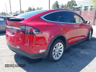 2016 Tesla Model X 70D with VIN 5YJXCAE23GF002262, listed as a IAAI auction lot 41839084 with 173,658 mi miles. Bid and sale history available at carsss.com. Image 4.