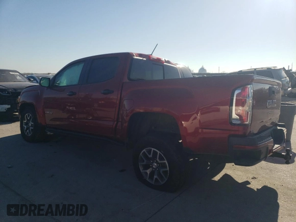 2021 GMC Canyon 4WD AT4 w/Cloth with VIN 1GTG6FEN2M1224875, listed as a Copart auction lot 77651494 with 81,495 mi miles and Salvage Title. Bid and sale history available at carsss.com. Image 2.